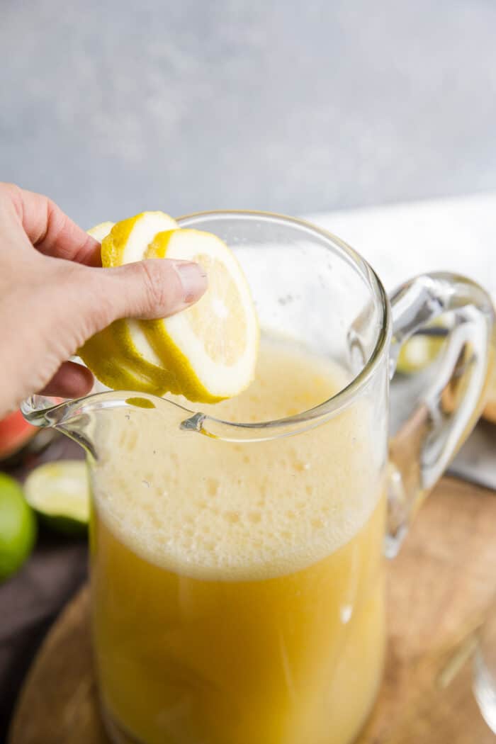 lemon slices added to a pitcher