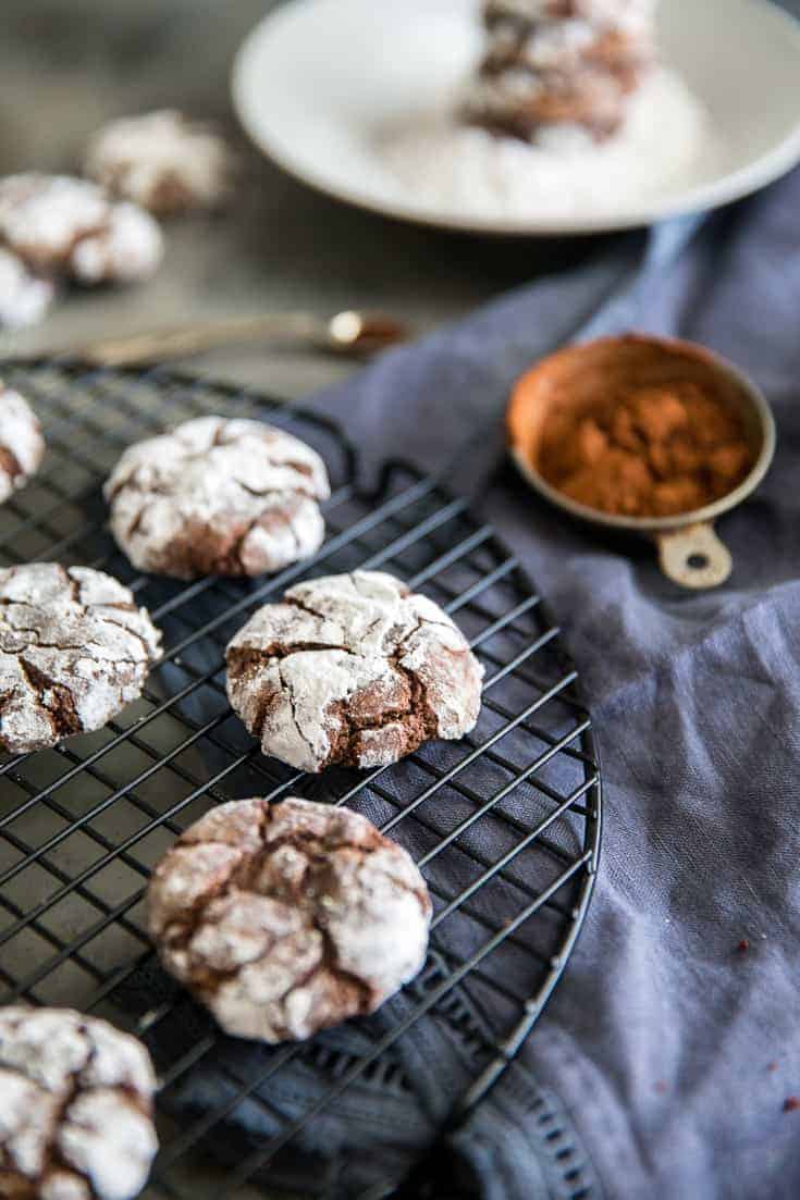 chocolate crinkle cookies side of cocoa powder