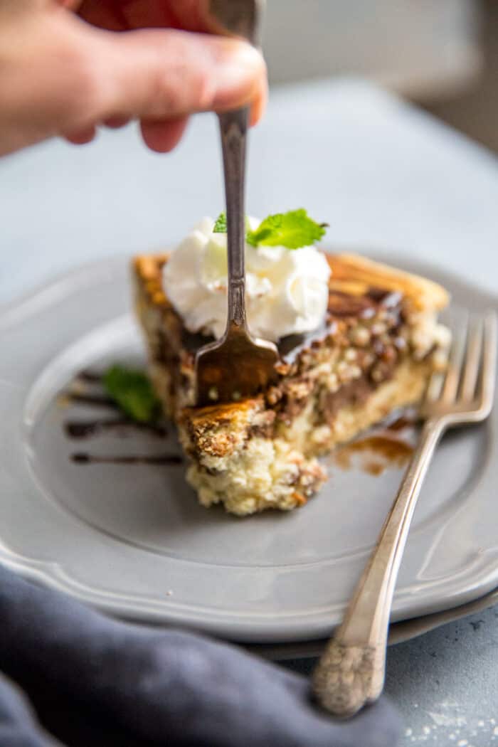 Tiramisu cheesecake fork taking a bite