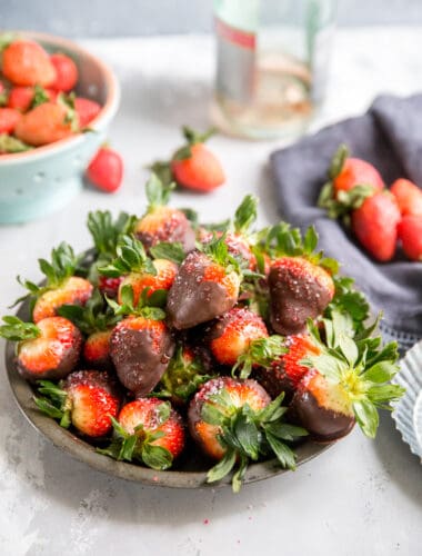 a bowl of chocolate covered strawberries