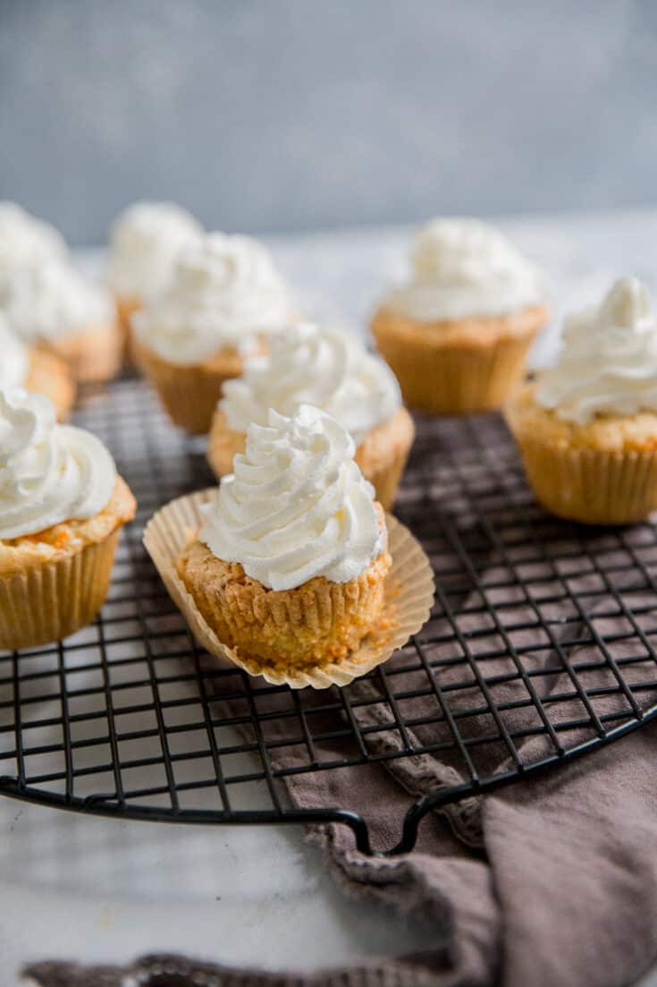 carrot cake cupcakes on a baking rack