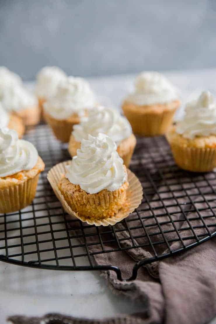 carrot cake cupcakes on a baking rack