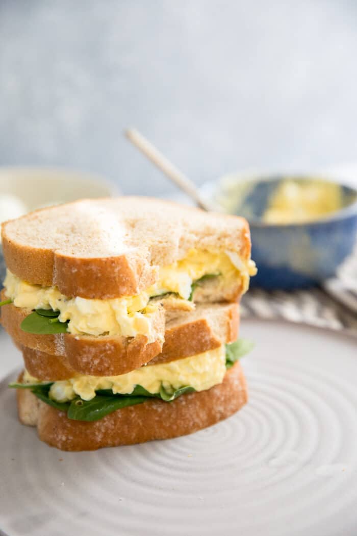 egg salad sandwich with a bite