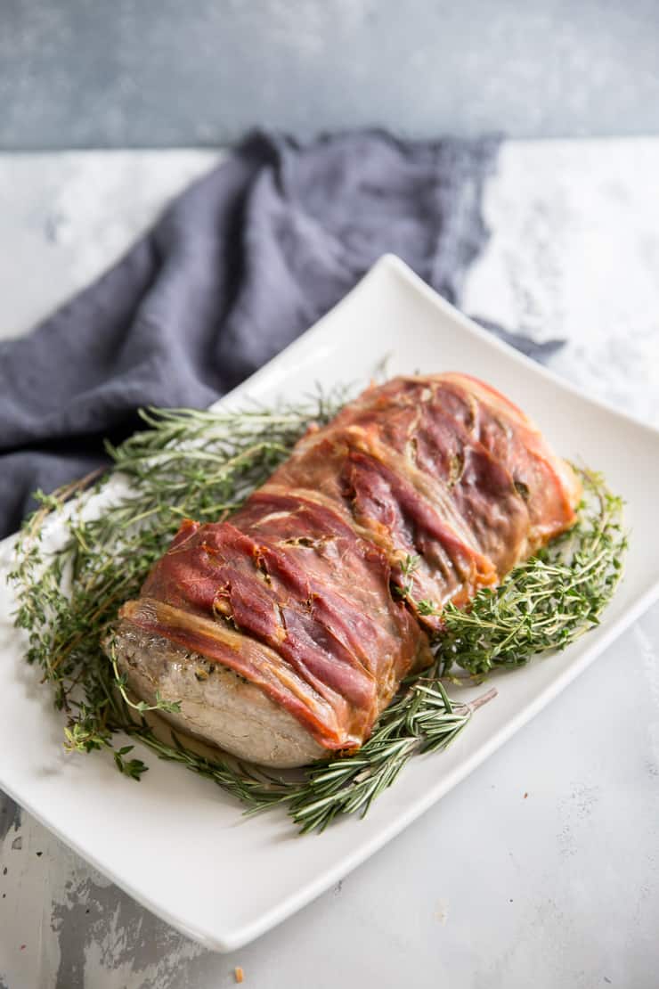 porchetta with fresh herbs on the side