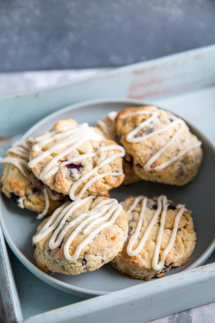 blueberry scones piled on a blue plate