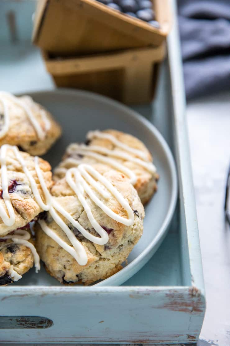 blueberry scones on a plate and a tray