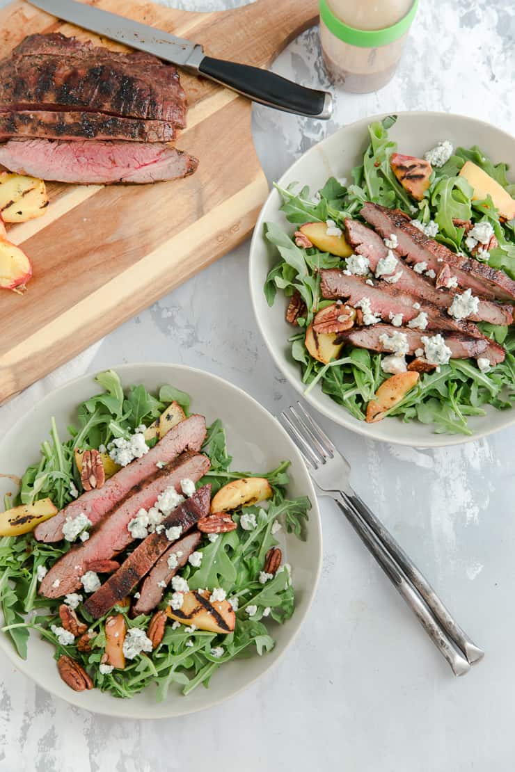 two bowls of black and blue steak salad