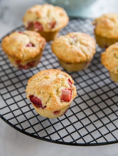 strawberry muffins on a baking rack