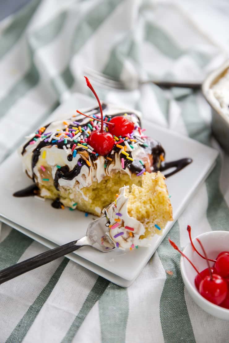 banana split cake with a fork and a bite on the fork
