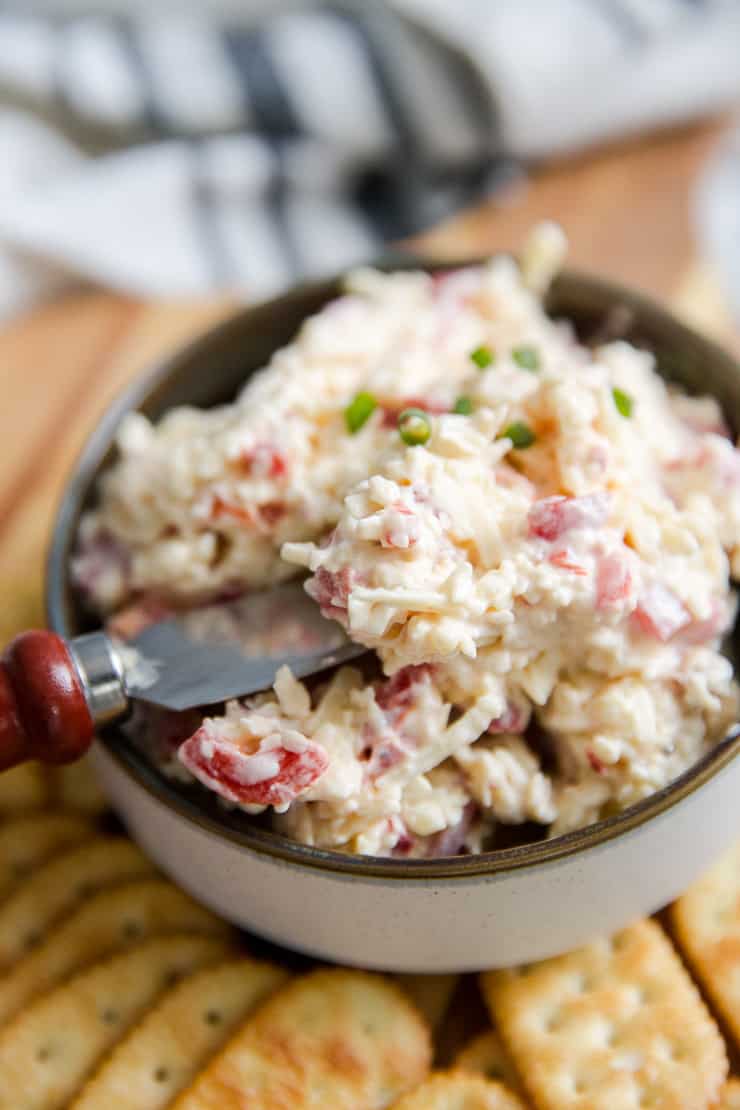 pimento cheese dip with a cheese spreader