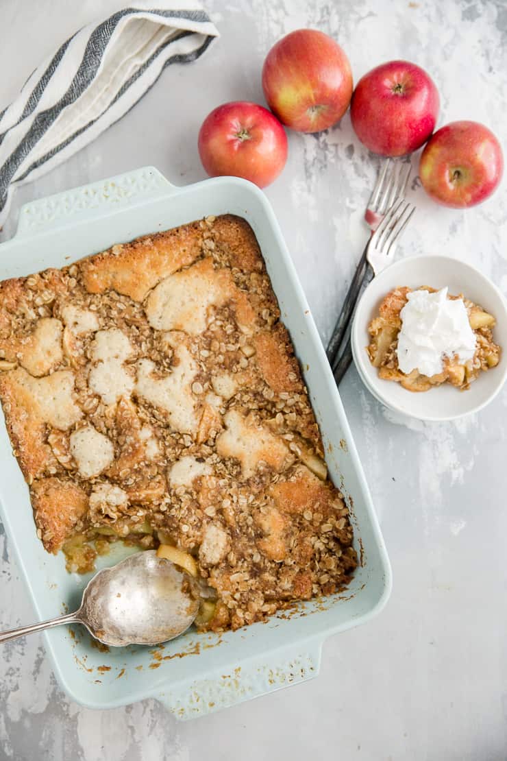 whole apple crisp with a serving on the side