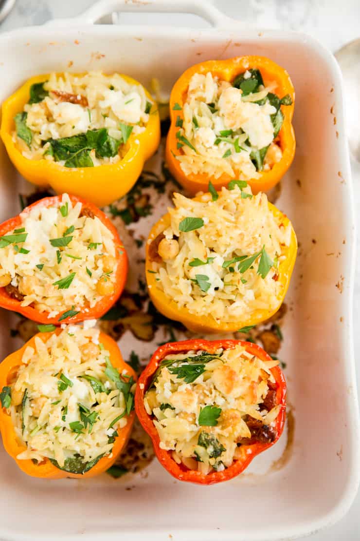 vegetarian stuffed peppers in a white baking dish