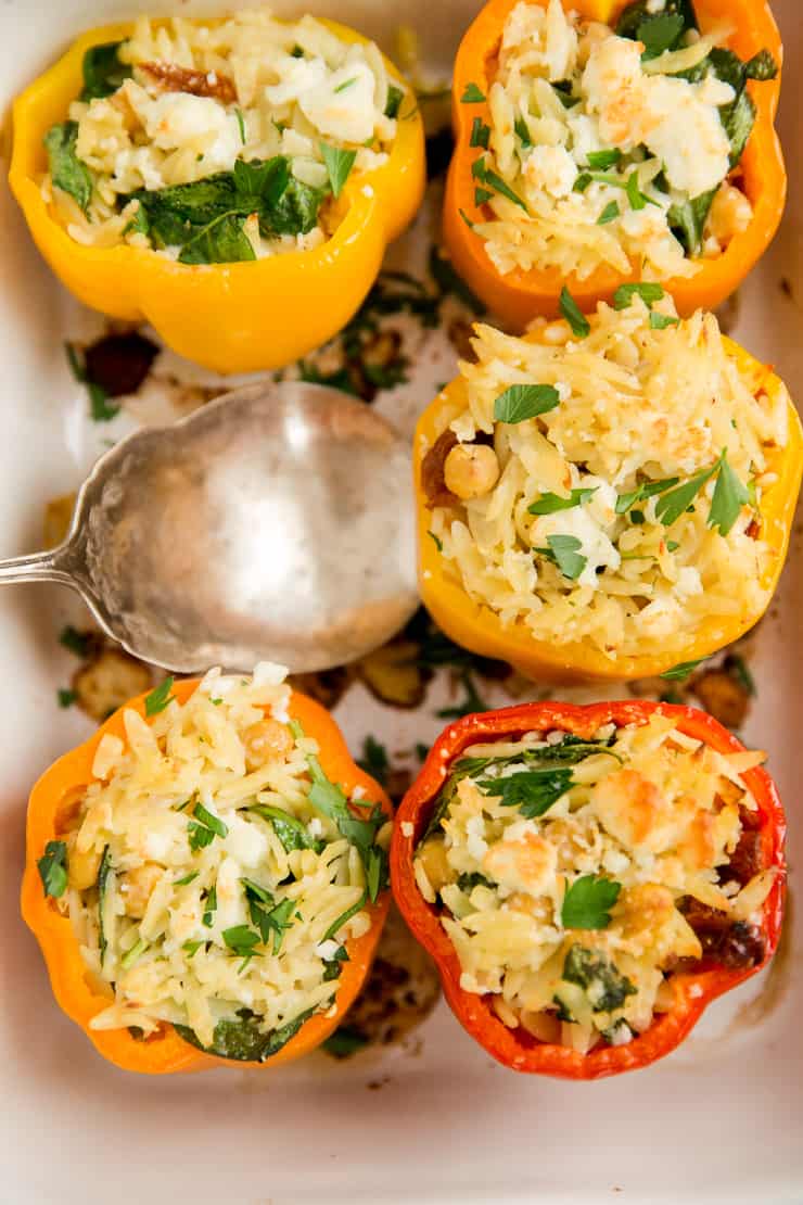 dish of vegetarian stuffed peppers with one missing
