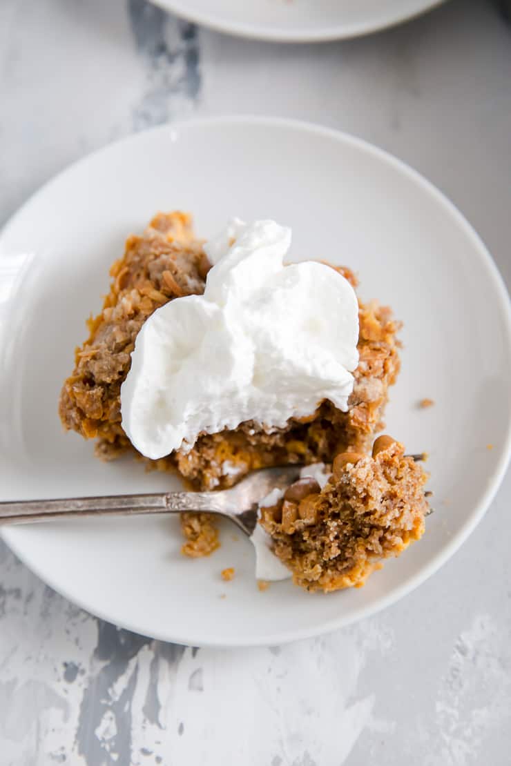 pumpkin dump cake with a fork taking a bite out of it