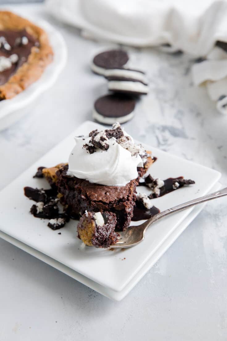 slutty brownie with a fork taking a bite out
