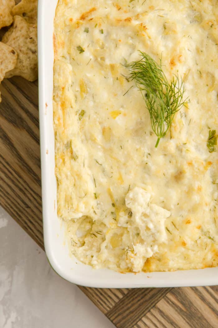 Artichoke dip that has been dipped into