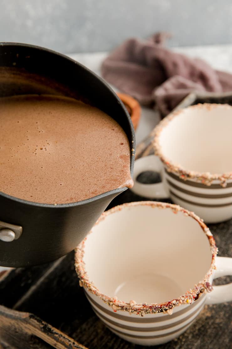 hot chocolate getting poured into a mug