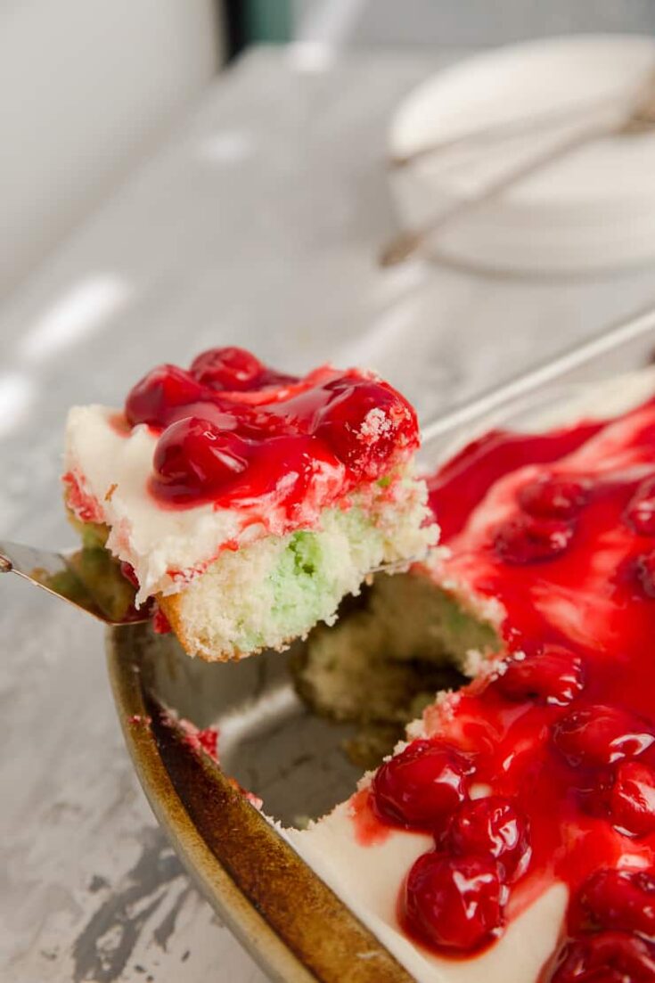 A piece of Jello poke cake being served