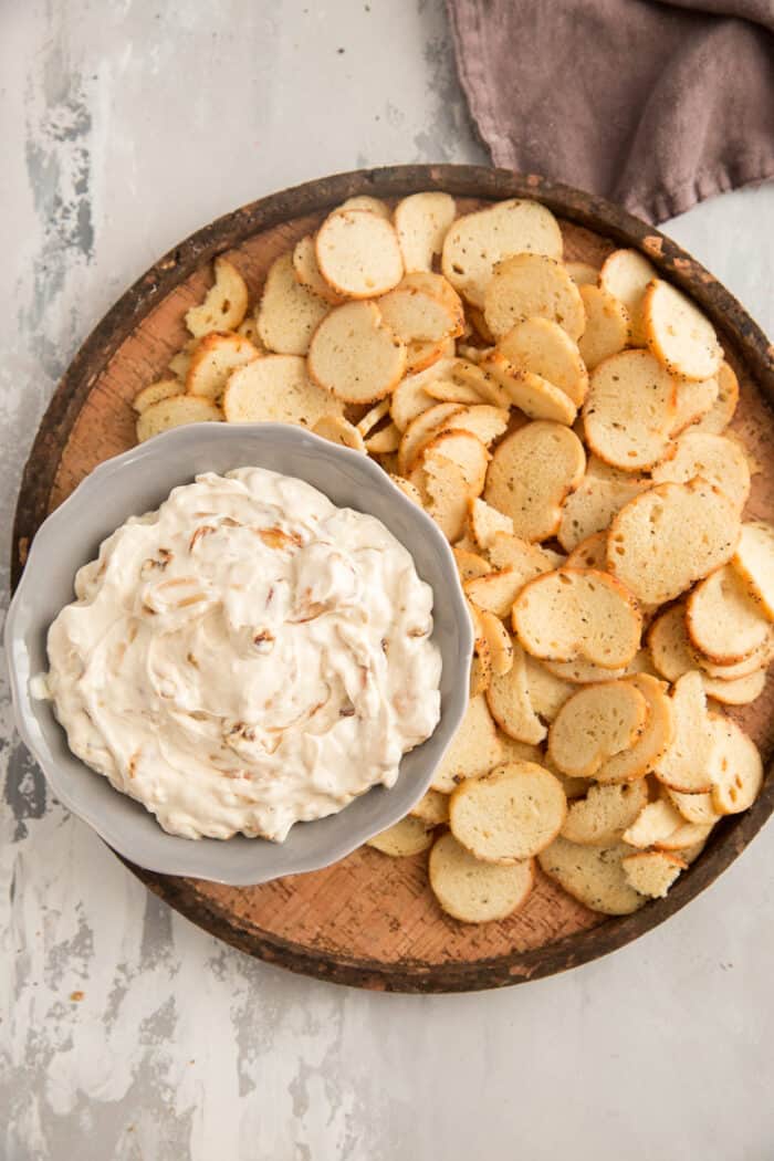 onion dip on a tray with crackers