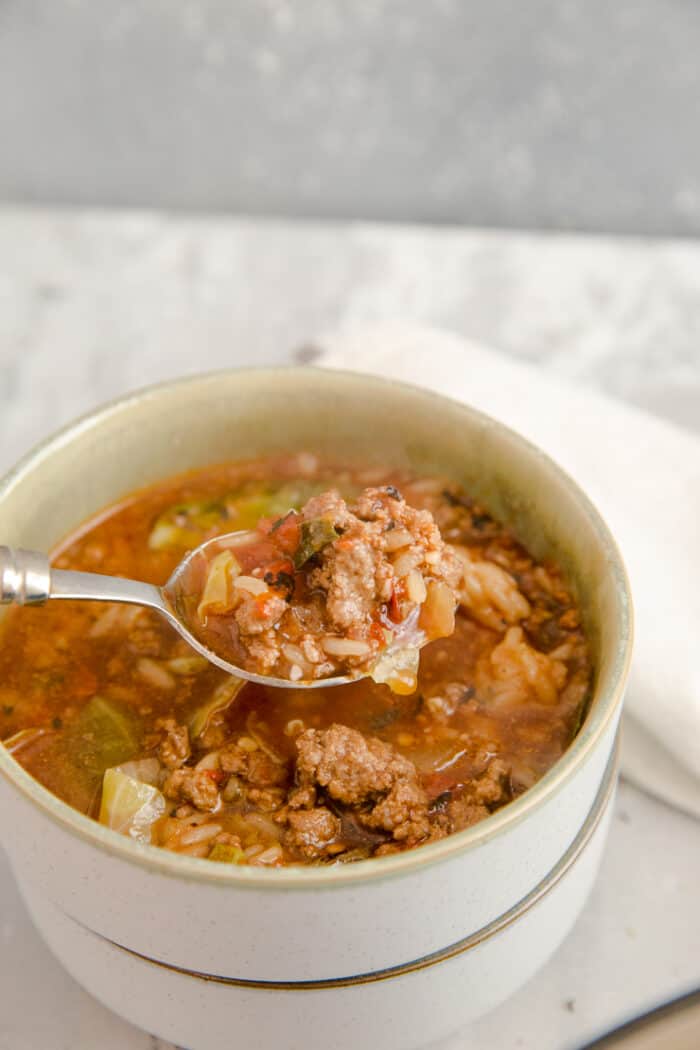 spoon in a bowl of cabbage roll soup