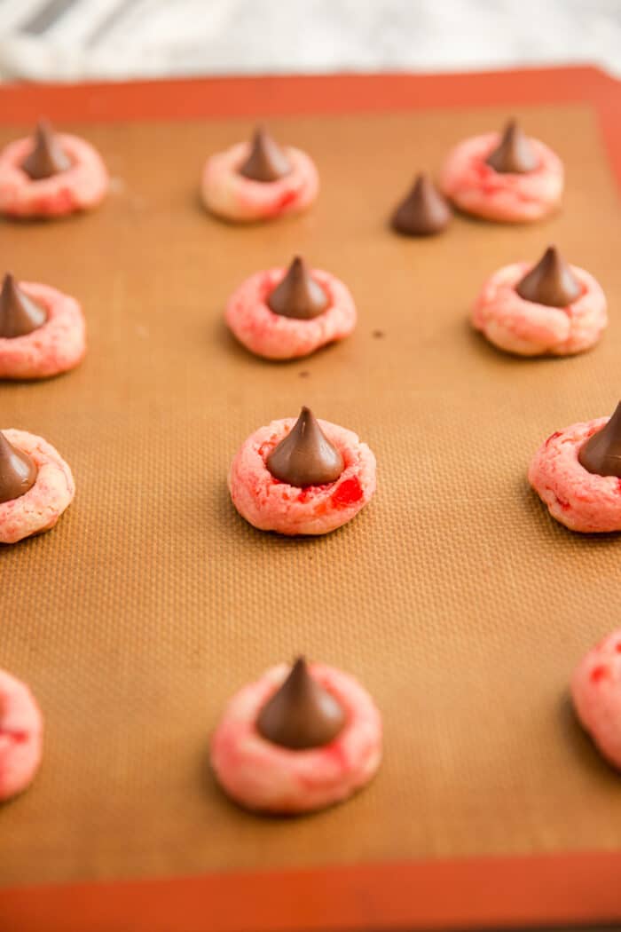 thumbprint cookies on a baking sheet