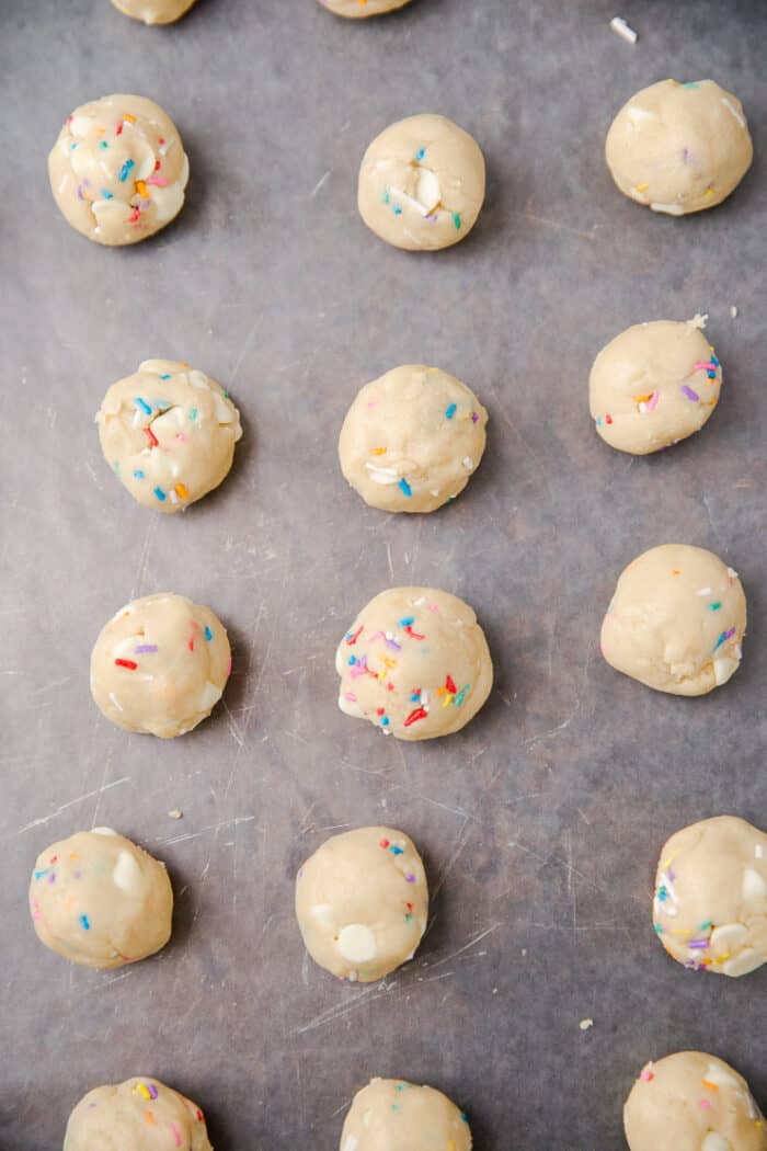 edible cookie dough balls on a cookie sheet