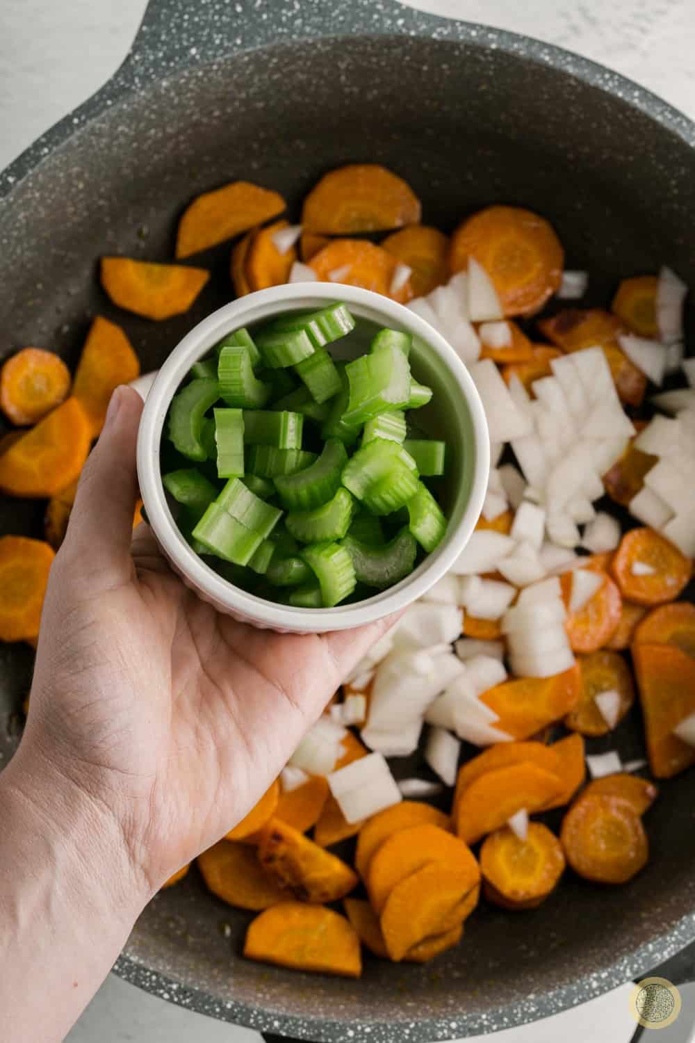 Add in the chopped celery, and saute until soft.