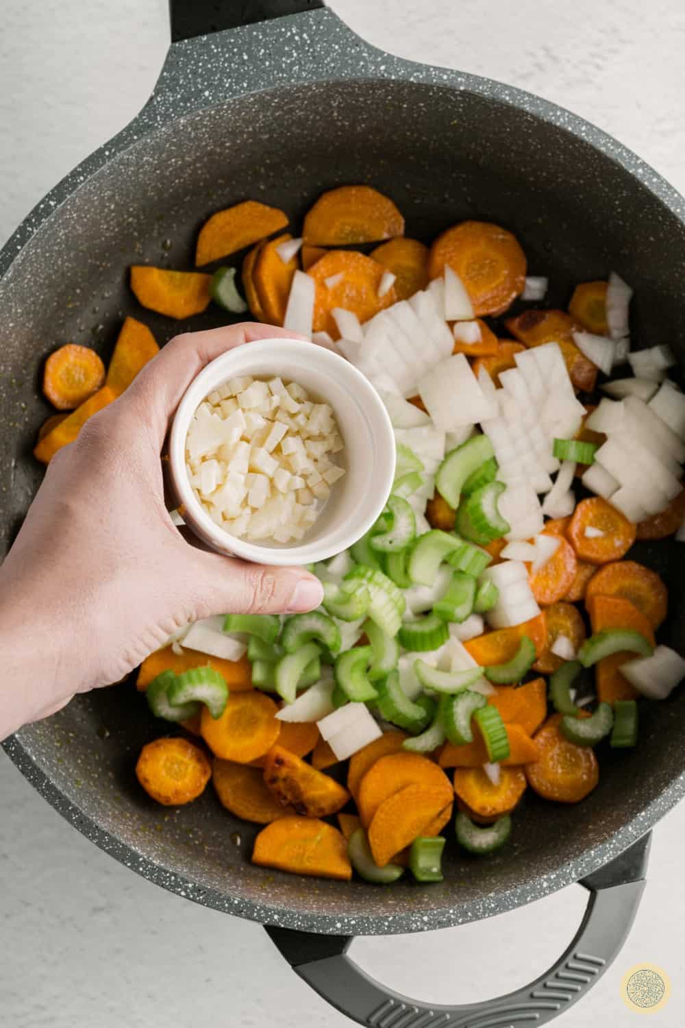 Add in the chopped garlic.
