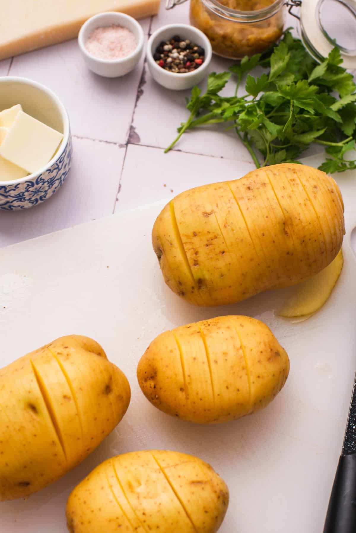 sliced Hasselback potatoes on cutting board