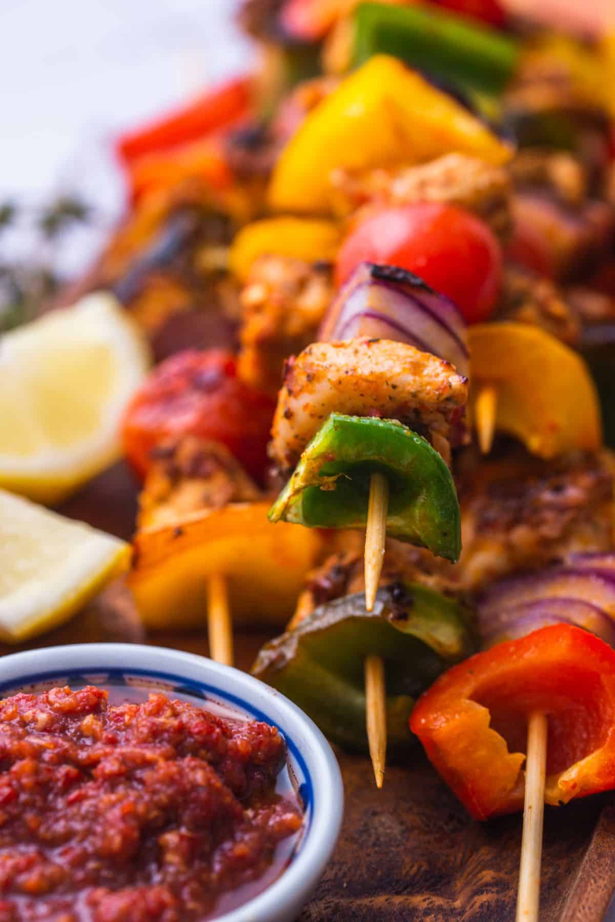 grilled chicken peppers onion and tomato on skewers