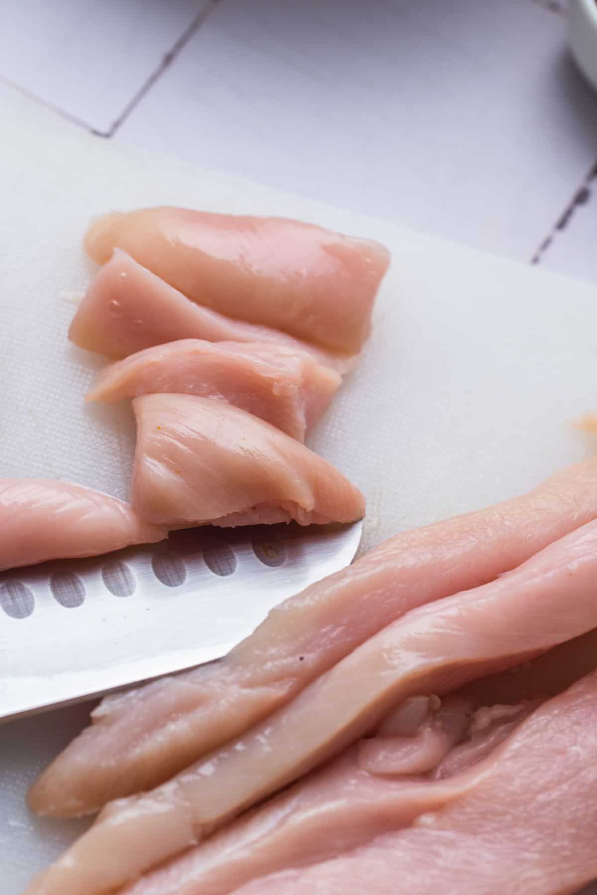 raw chicken breasts cut into pieces