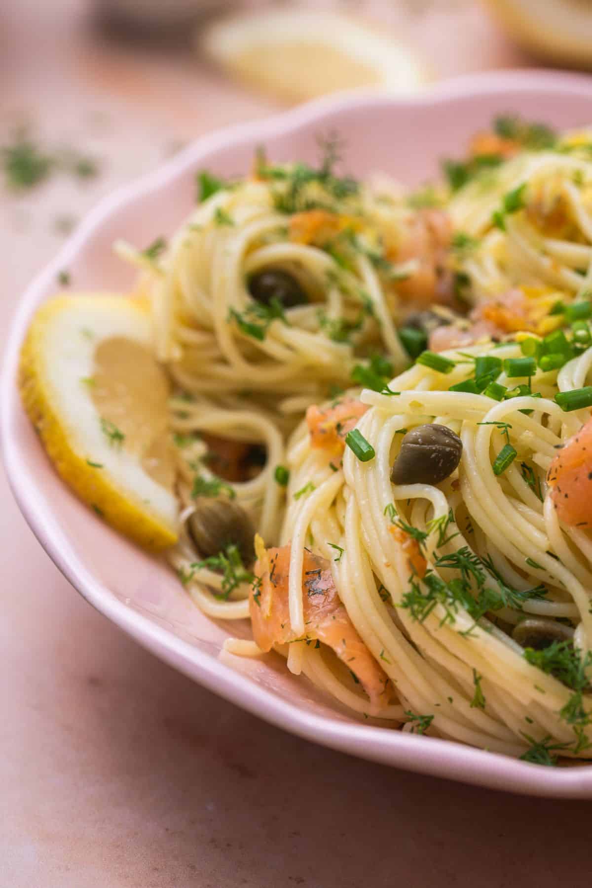 pasta with salmon and slice of lemon