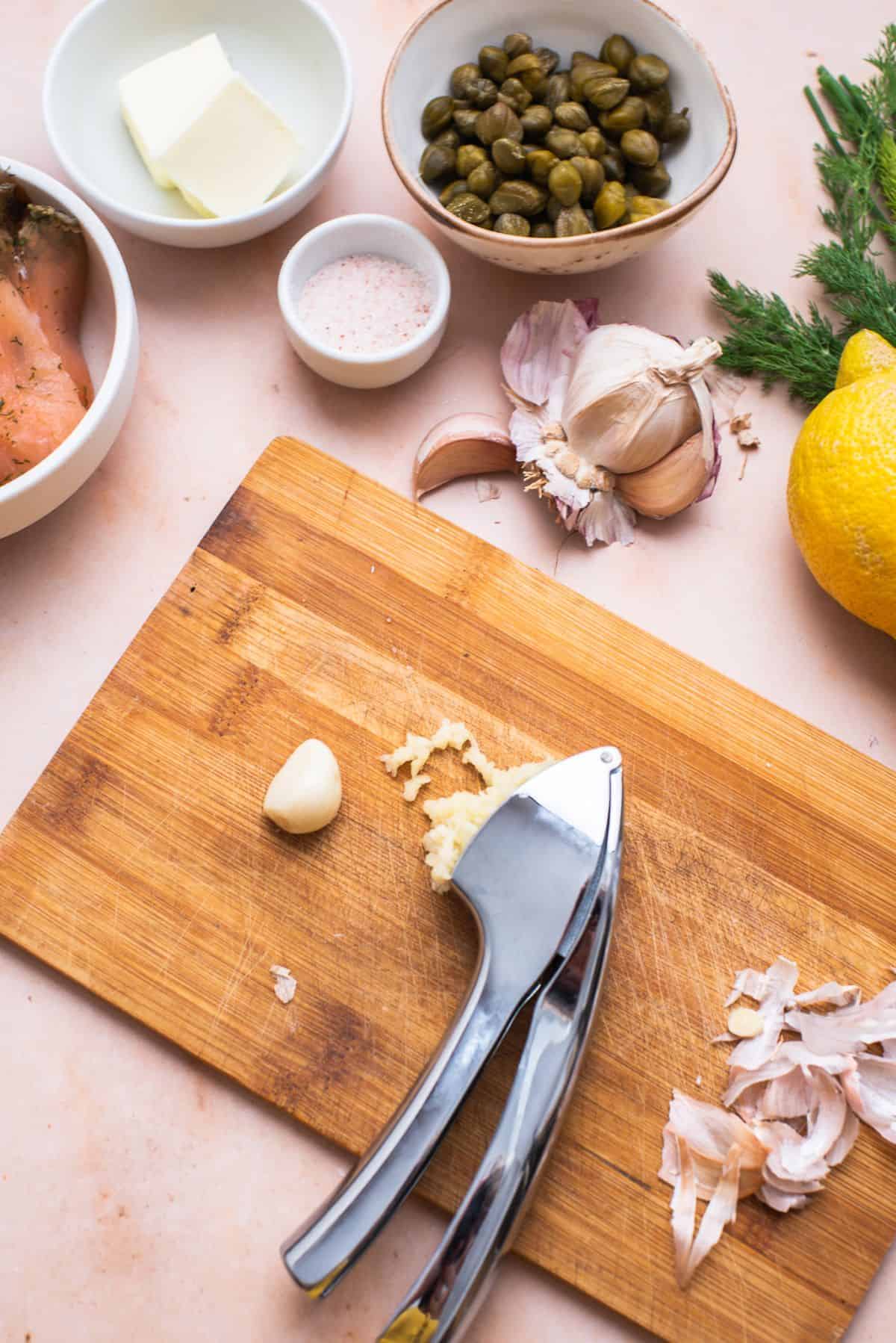 mincing garlic on cutting board