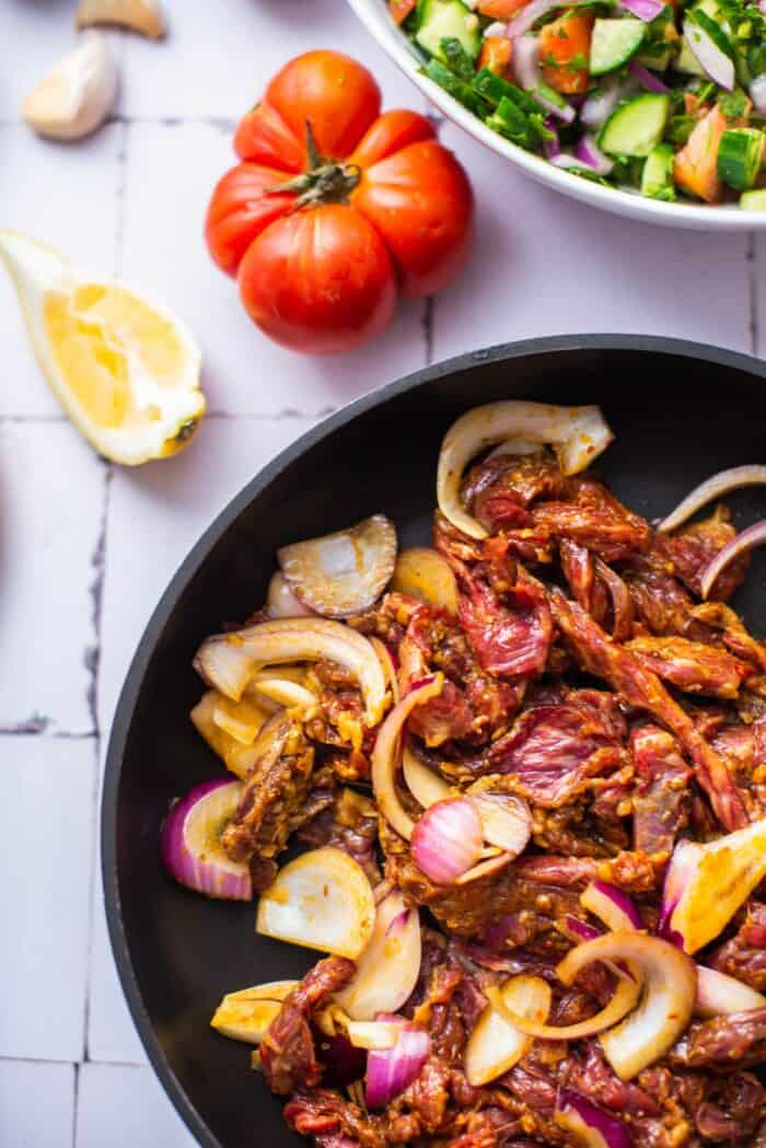 cook the beef, onions, and seasoning in a pan