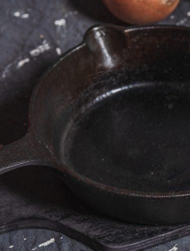 A rusty cast-iron skillet may not need replacing. A cut potato and baking soda can help remove light surface rust before drying and reseasoning.